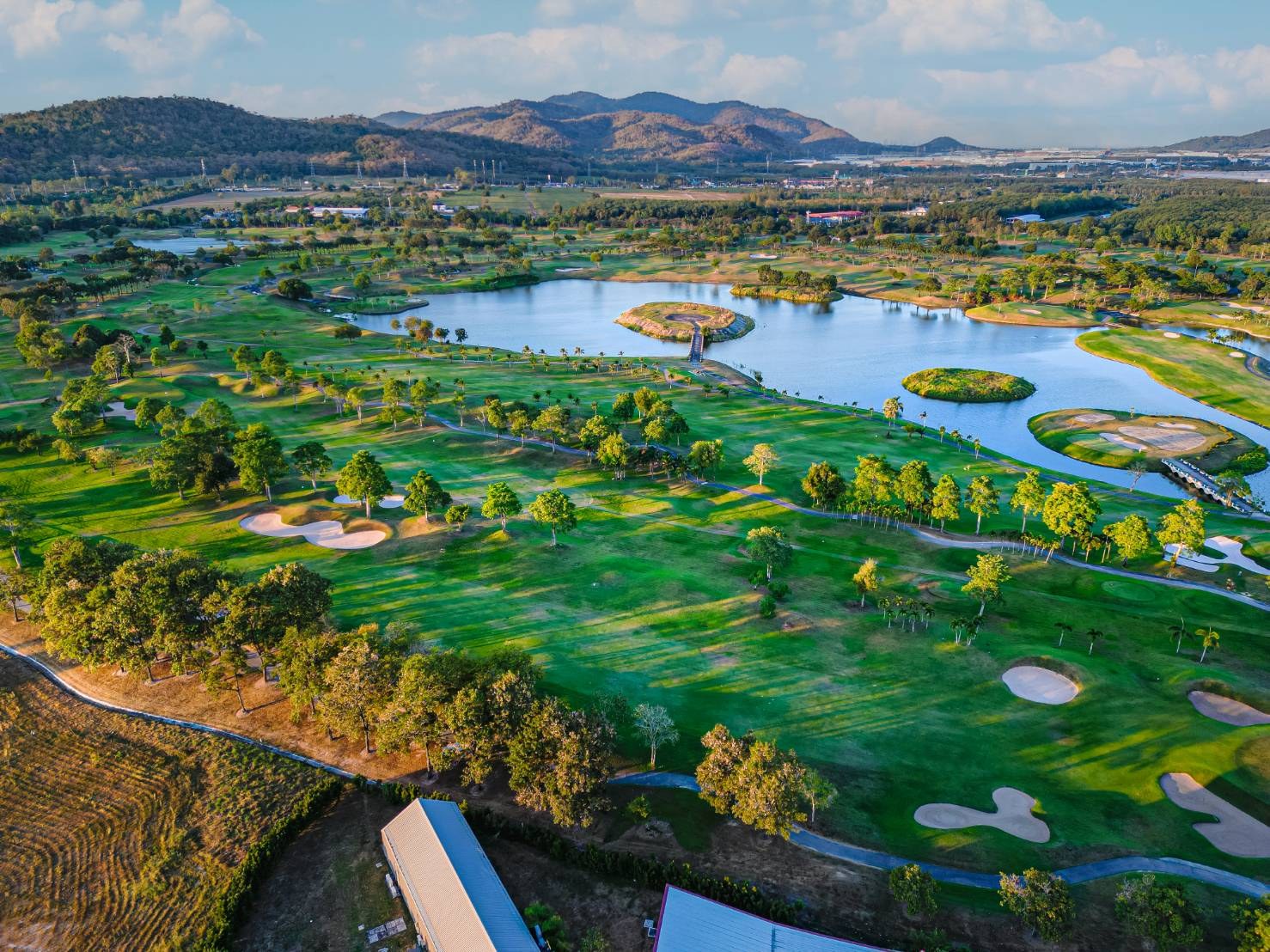 Aerial view of Pattana Golf and Sports Resort, Pattaya, showing the lakes and bunkers